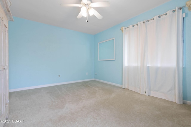 unfurnished room with light carpet and ceiling fan