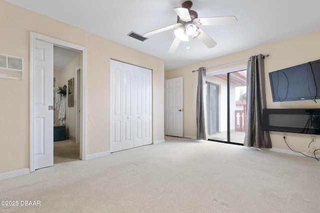 unfurnished bedroom with light carpet, access to exterior, ceiling fan, and a closet