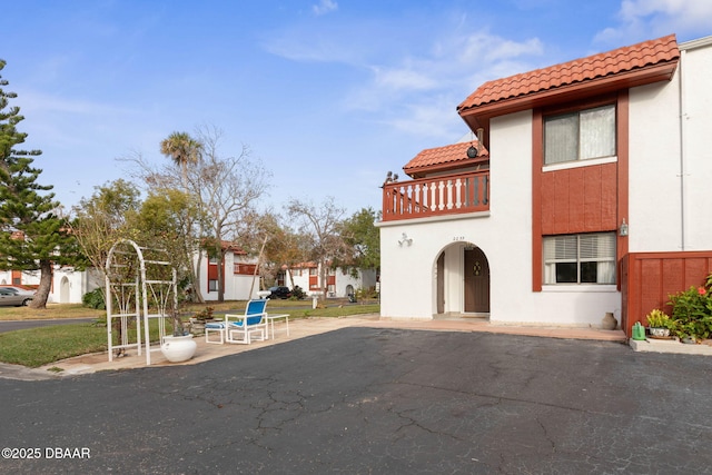 exterior space featuring a patio and a balcony