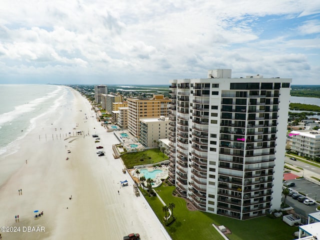 aerial view featuring a view of the beach and a water view