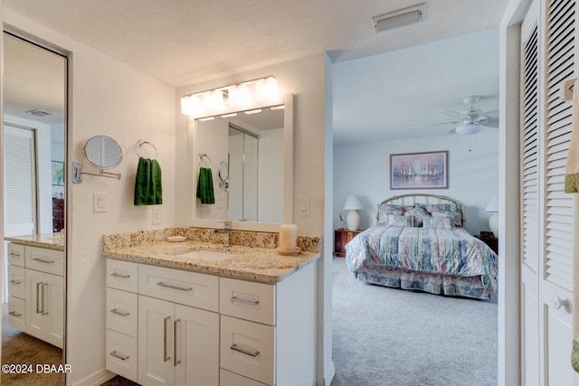 bathroom featuring ceiling fan and vanity