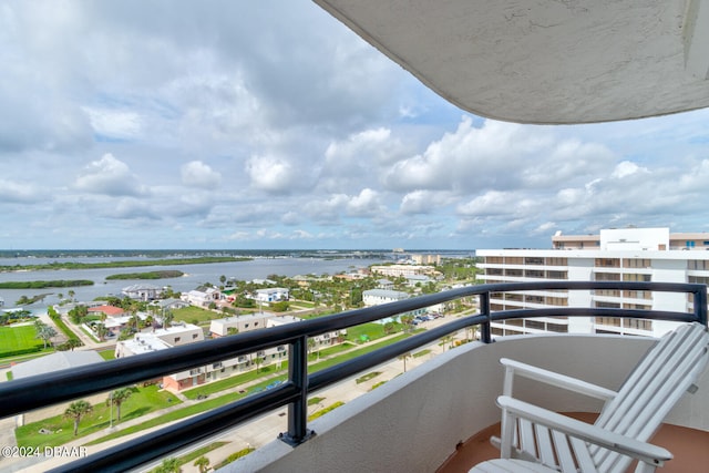 balcony featuring a water view