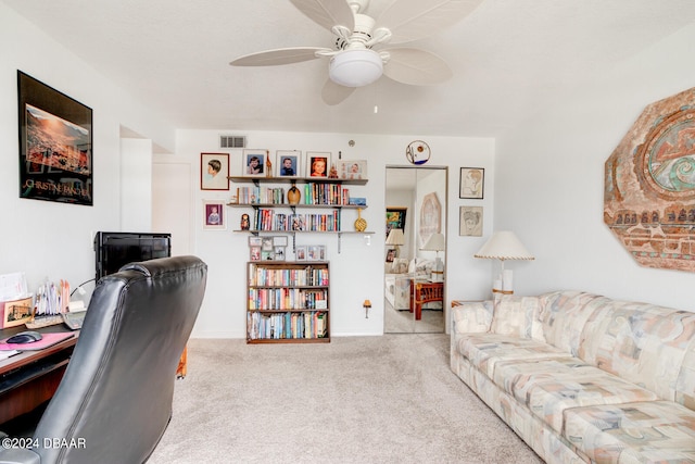 carpeted home office with ceiling fan