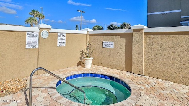 view of pool featuring a community hot tub