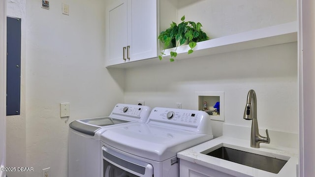 clothes washing area with cabinet space and washing machine and clothes dryer