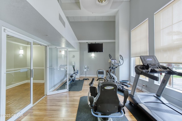 2300 N Atlantic Ave Unit 303, Daytona Beach, FL 32118 - workout area with light wood finished floors, visible vents, and baseboards