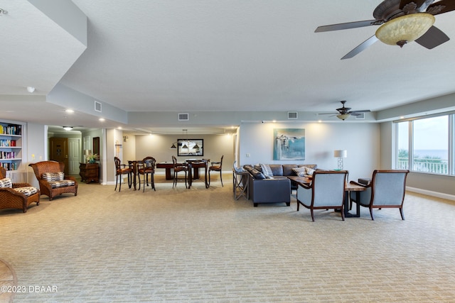 2300 N Atlantic Ave Unit 303, Daytona Beach, FL 32118 - living area with light colored carpet, baseboards, and visible vents