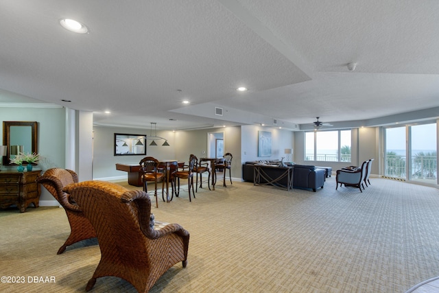 2300 N Atlantic Ave Unit 303, Daytona Beach, FL 32118 - living room with baseboards, light carpet, recessed lighting, a textured ceiling, and a ceiling fan