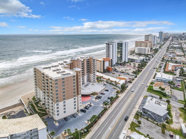 bird's eye view featuring a view of the beach and a water view