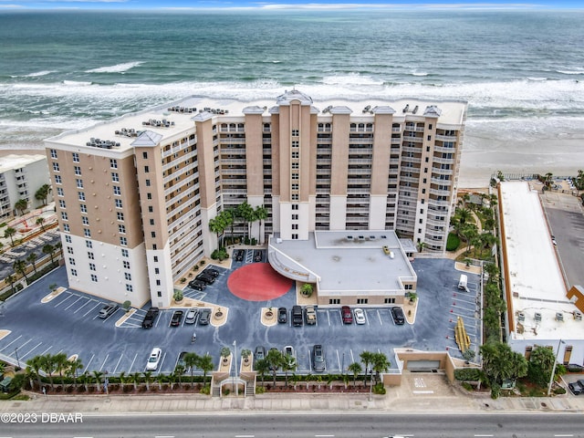 bird's eye view with a water view and a view of the beach