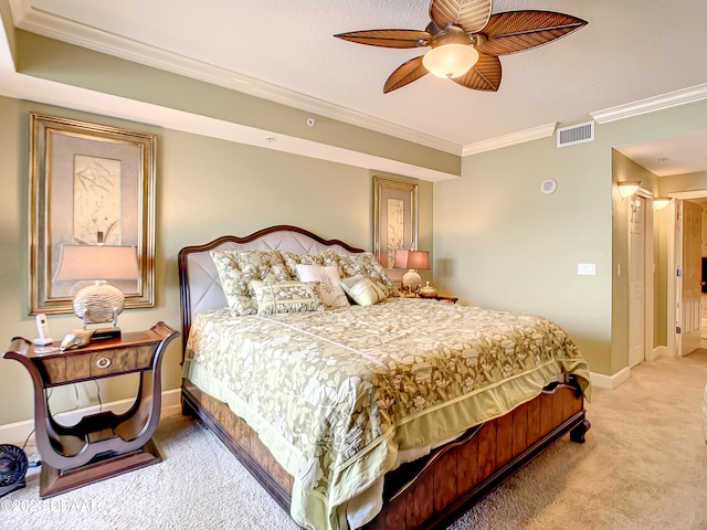 carpeted bedroom with ceiling fan and crown molding