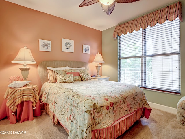 bedroom with ceiling fan and carpet flooring