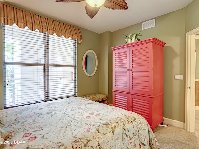 carpeted bedroom featuring ceiling fan