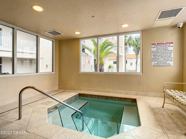 view of pool featuring an indoor in ground hot tub