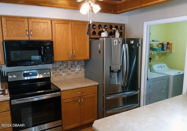 kitchen with separate washer and dryer, stainless steel appliances, and tasteful backsplash