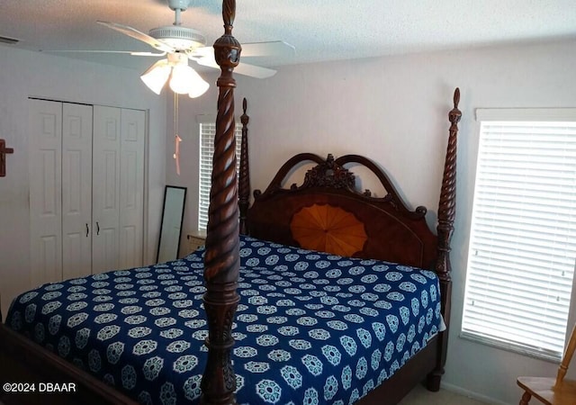 bedroom with a textured ceiling, a closet, and ceiling fan