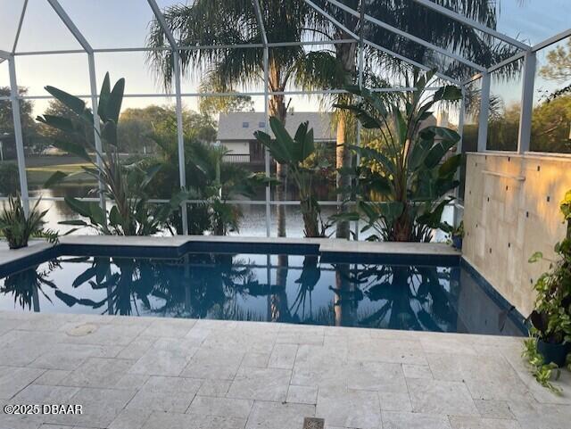 view of pool featuring a lanai and a patio area