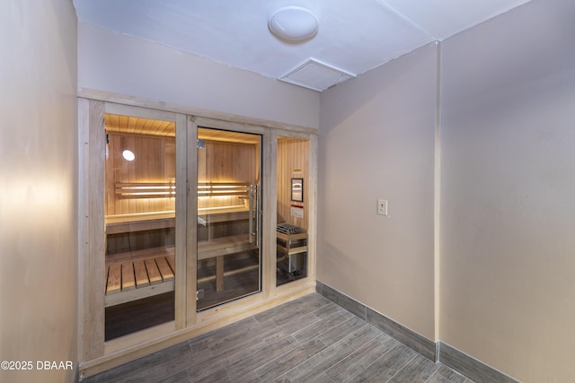 view of sauna with wood finished floors and baseboards