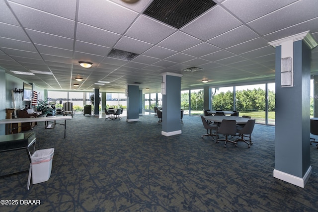 gym with a drop ceiling, baseboards, visible vents, and carpet floors