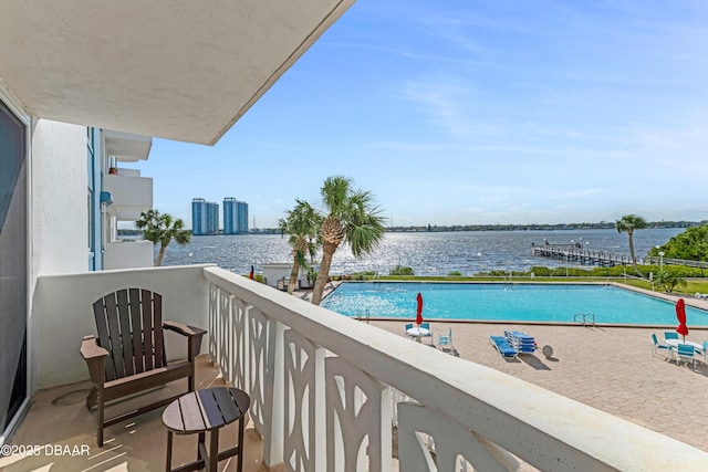 balcony featuring a water view