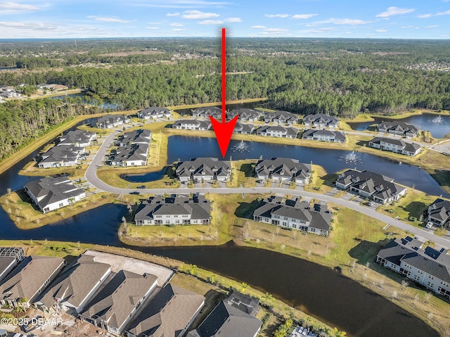 bird's eye view featuring a water view, a residential view, and a view of trees