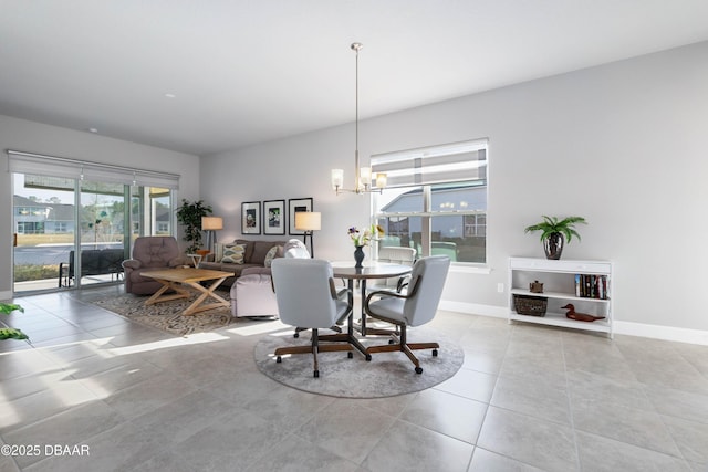 tiled dining space with a notable chandelier