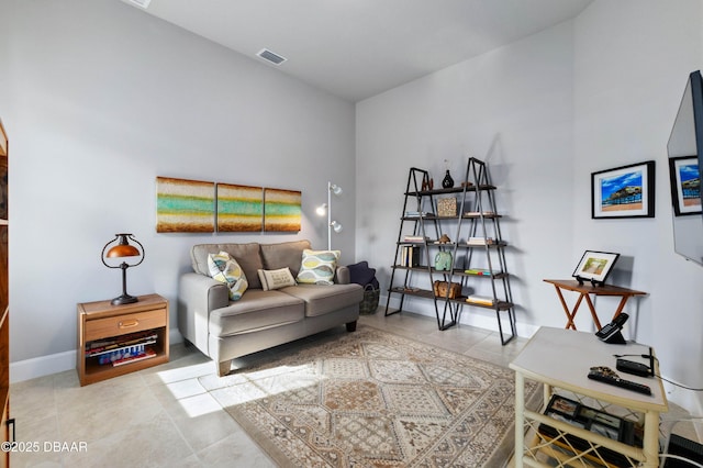 interior space with light tile patterned floors, visible vents, and baseboards