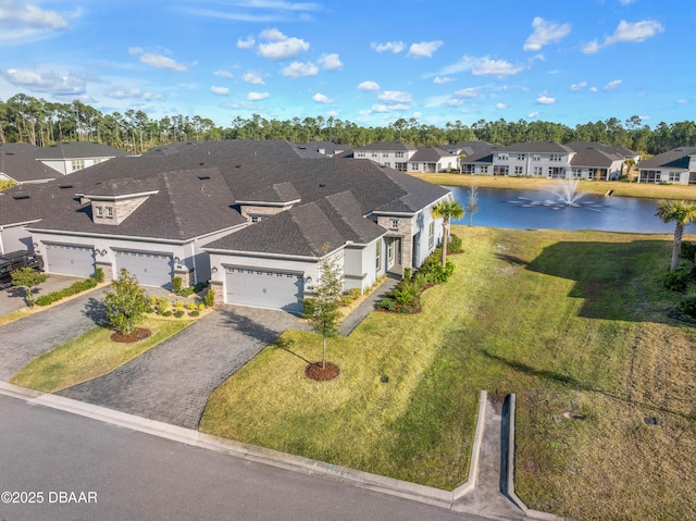 aerial view featuring a water view and a residential view