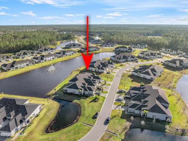 aerial view with a water view and a residential view