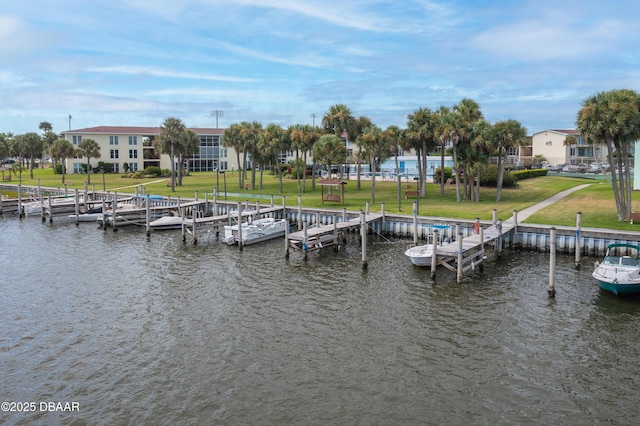 721 S Beach St Unit 205, Daytona Beach, FL 32114 - dock area featuring a water view and a yard