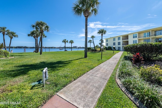 721 S Beach St Unit 205, Daytona Beach, FL 32114 - surrounding community with a yard and a water view