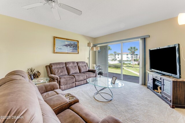 721 S Beach St Unit 205, Daytona Beach, FL 32114 - carpeted living area featuring a ceiling fan