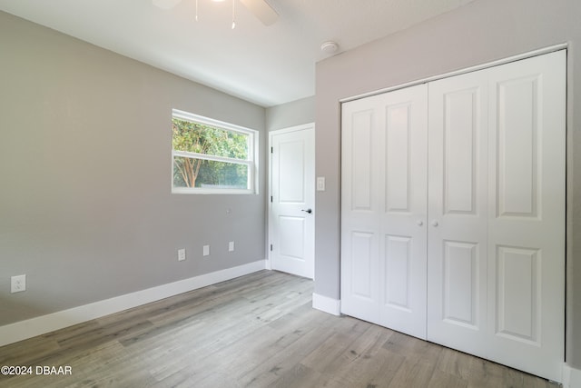 unfurnished bedroom featuring a closet, ceiling fan, and light hardwood / wood-style floors