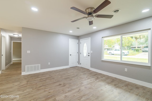 empty room featuring light hardwood / wood-style floors and ceiling fan