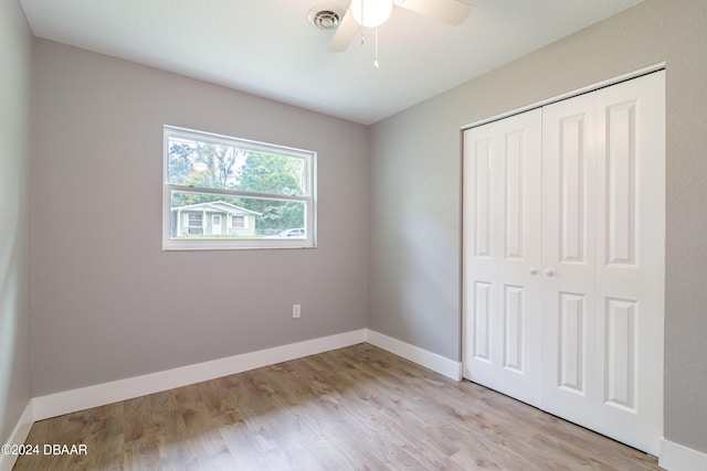 unfurnished bedroom with a closet, ceiling fan, and light hardwood / wood-style flooring