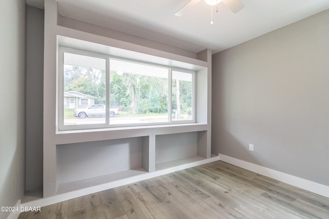 unfurnished room with ceiling fan and light hardwood / wood-style floors