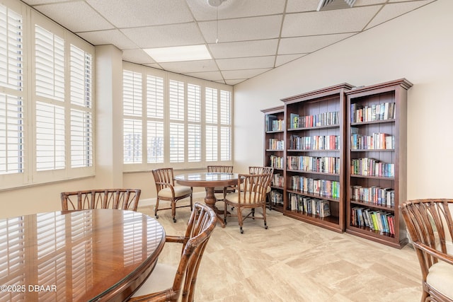 3047 S Atlantic Ave Unit 706, Daytona Beach Shores, FL 32118 - dining room with a drop ceiling and plenty of natural light