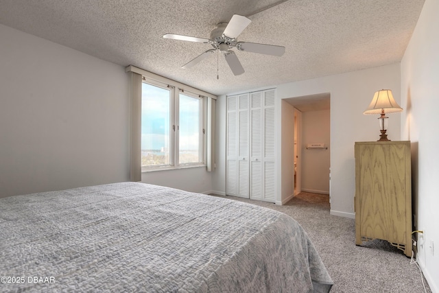 3047 S Atlantic Ave Unit 706, Daytona Beach Shores, FL 32118 - bedroom with carpet floors, a textured ceiling, a closet, and ceiling fan