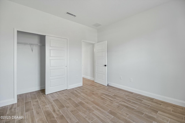 unfurnished bedroom with a closet