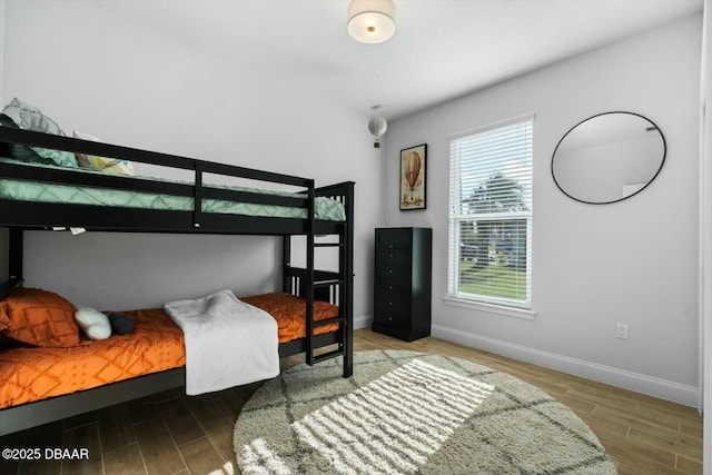 bedroom with hardwood / wood-style flooring