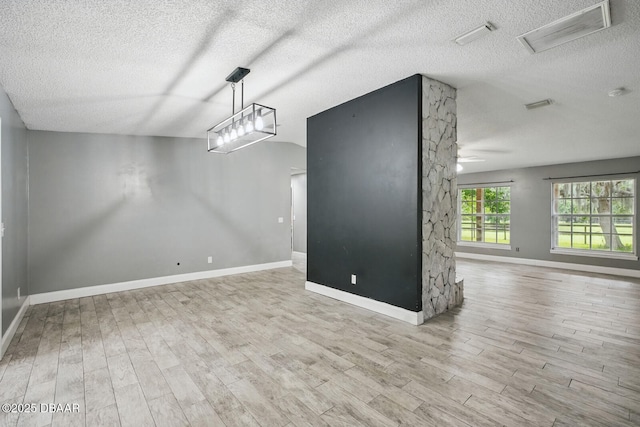 2950 Ragis Rd, Edgewater, FL 32132 - unfurnished dining area with a textured ceiling, wood finished floors, and a ceiling fan