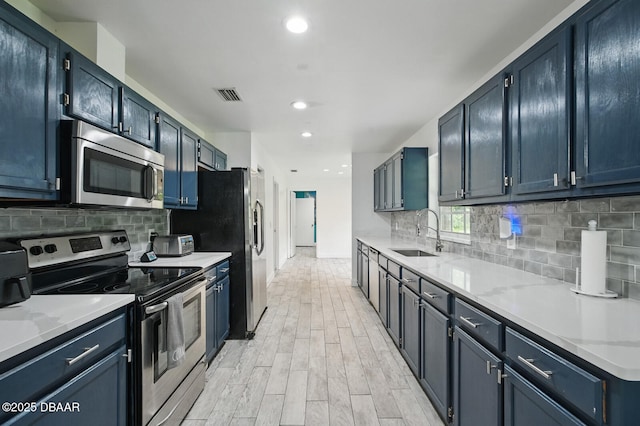 2950 Ragis Rd, Edgewater, FL 32132 - kitchen featuring appliances with stainless steel finishes, light wood-style flooring, tasteful backsplash, and recessed lighting