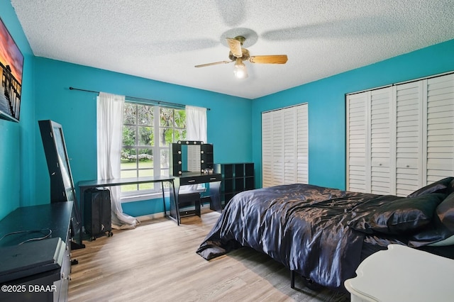 2950 Ragis Rd, Edgewater, FL 32132 - bedroom with wood finished floors, a textured ceiling, and a ceiling fan