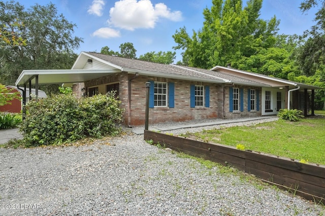 2950 Ragis Rd, Edgewater, FL 32132 - view of front facade featuring brick siding and a front yard