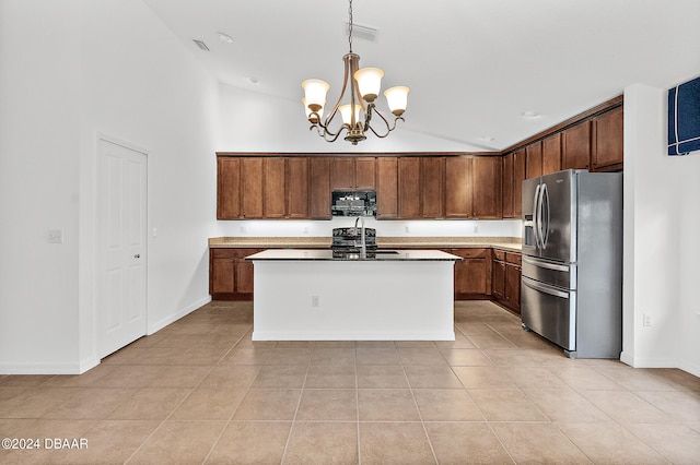 665 Elk River Dr, Ormond Beach, FL 32174 - kitchen with a center island with sink, sink, stainless steel refrigerator with ice dispenser, light tile patterned floors, and decorative light fixtures