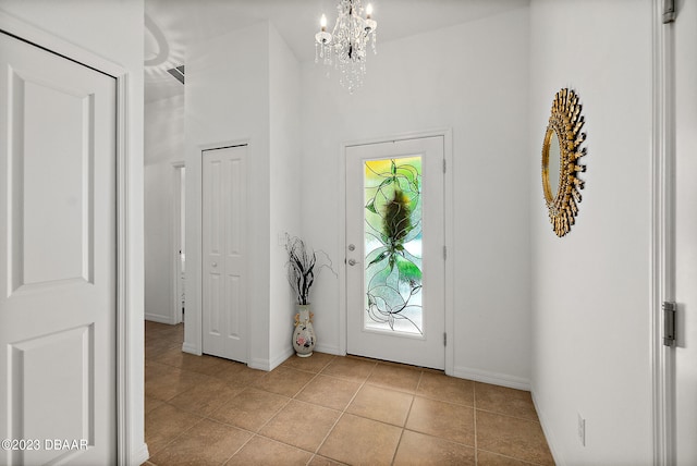 entrance foyer featuring a notable chandelier and light tile patterned floors