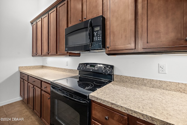 665 Elk River Dr, Ormond Beach, FL 32174 - kitchen featuring black appliances and light tile patterned flooring