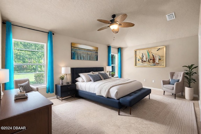 665 Elk River Dr, Ormond Beach, FL 32174 - carpeted bedroom featuring a textured ceiling and ceiling fan