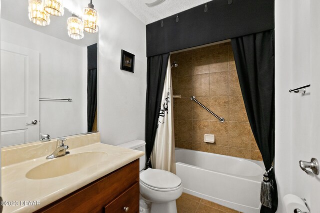 665 Elk River Dr, Ormond Beach, FL 32174 - full bathroom featuring vanity, a textured ceiling, shower / bath combo, tile patterned flooring, and toilet