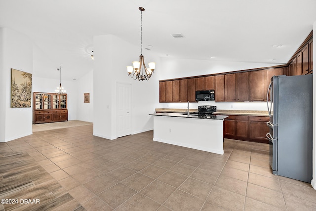 665 Elk River Dr, Ormond Beach, FL 32174 - kitchen featuring hanging light fixtures, a center island with sink, black appliances, and high vaulted ceiling